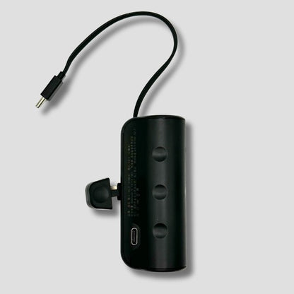 BoostBuddy portable charger with a USB-C connector, highlighting its versatile connectivity.