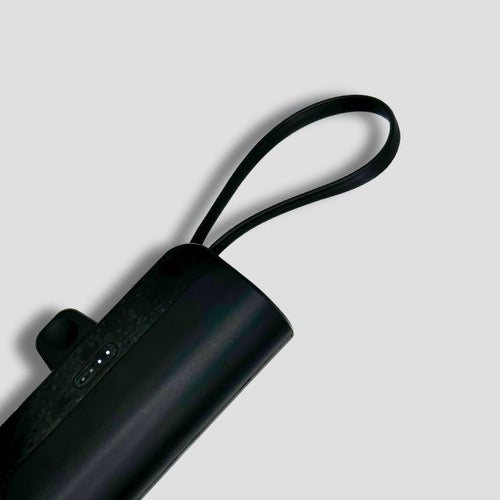 Close-up of BoostBuddy charger’s loop handle, showing the sleek and compact build for easy transport.